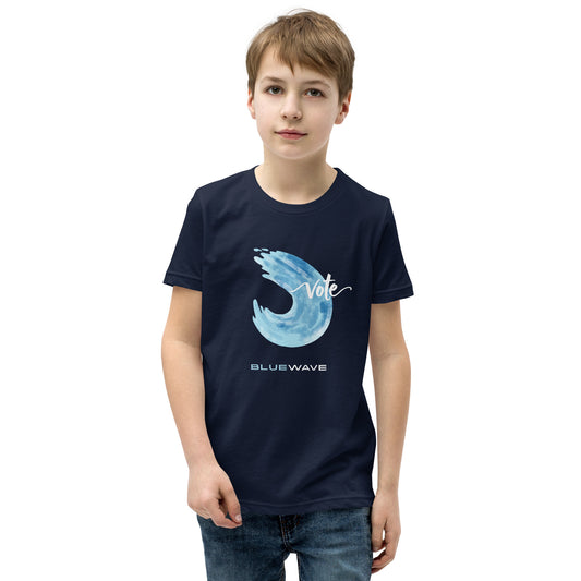 Child wearing a navy Vote Blue Wave youth tee
